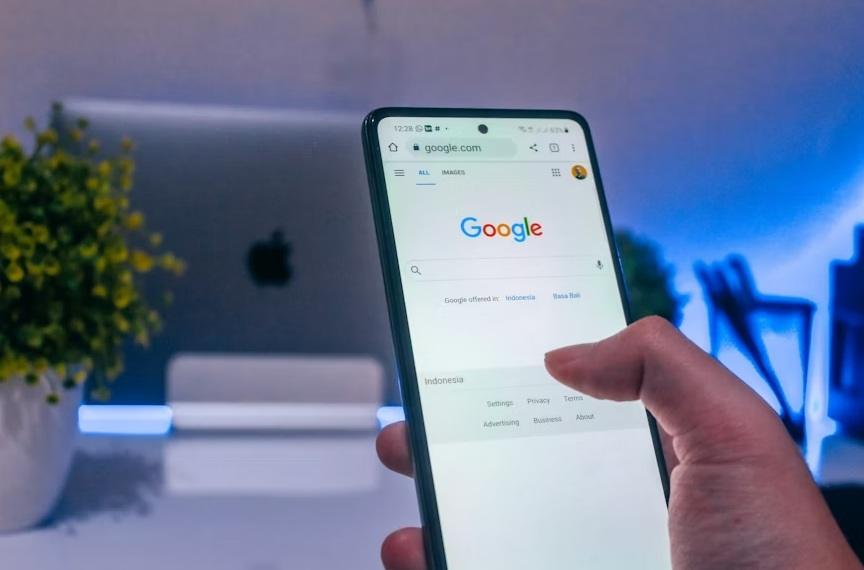 Person starting a Google search on their phone.